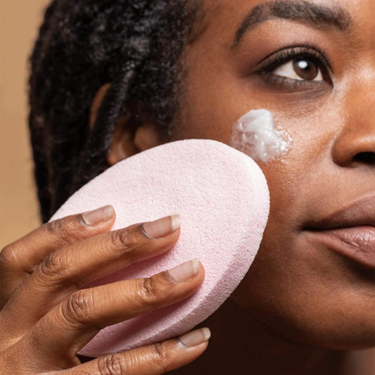 Using Compressed Facial Cleansing Sponges for deep facial cleansing and gentle exfoliation.